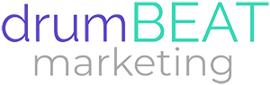 Logo for drumBEAT marketing. The text is styled with 'drum' in lowercase purple letters, 'BEAT' in uppercase teal letters, and 'marketing' in lowercase gray letters. The design is clean and modern, emphasizing the 'BEAT' portion of the name.